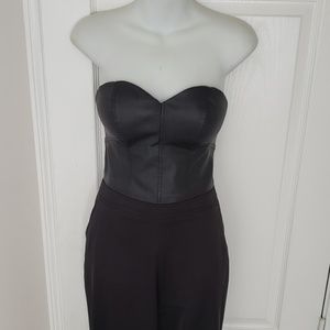 Strapless romper with a faux leather Top.